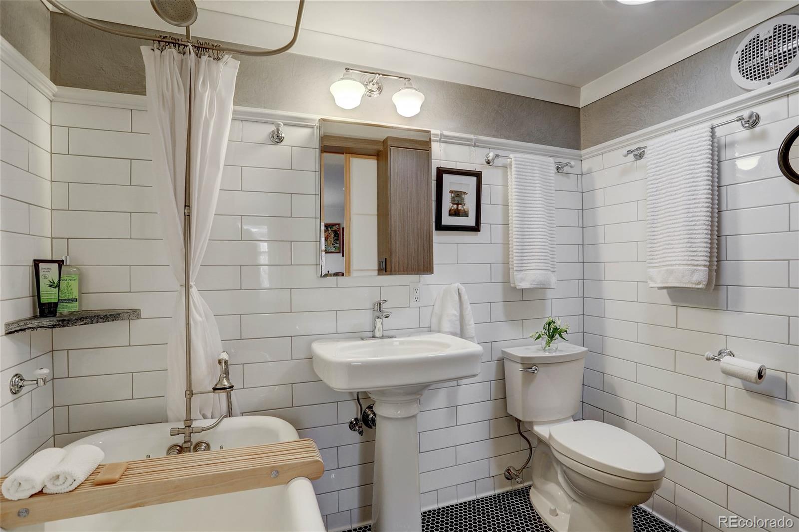 933 Cherryvale Road Boulder, CO 80303 - Photo 15 of 32 a bathroom with a sink toilet and shower