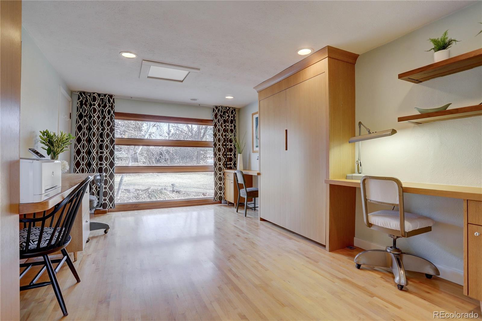 933 Cherryvale Road Boulder, CO 80303 - Photo 20 of 32 a view of a workspace with furniture and a window