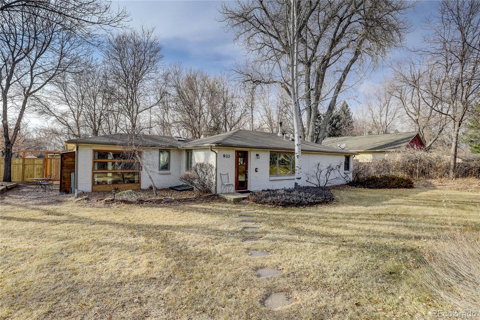 933 Cherryvale Road Boulder, CO 80303 - Photo 2 of 32 a view of a house with a large tree in front of it