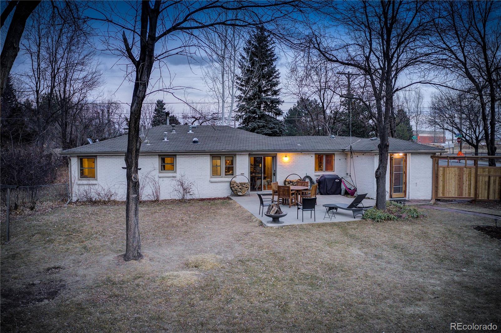 933 Cherryvale Road Boulder, CO 80303 - Photo 23 of 32 a view of a house with backyard and sitting area