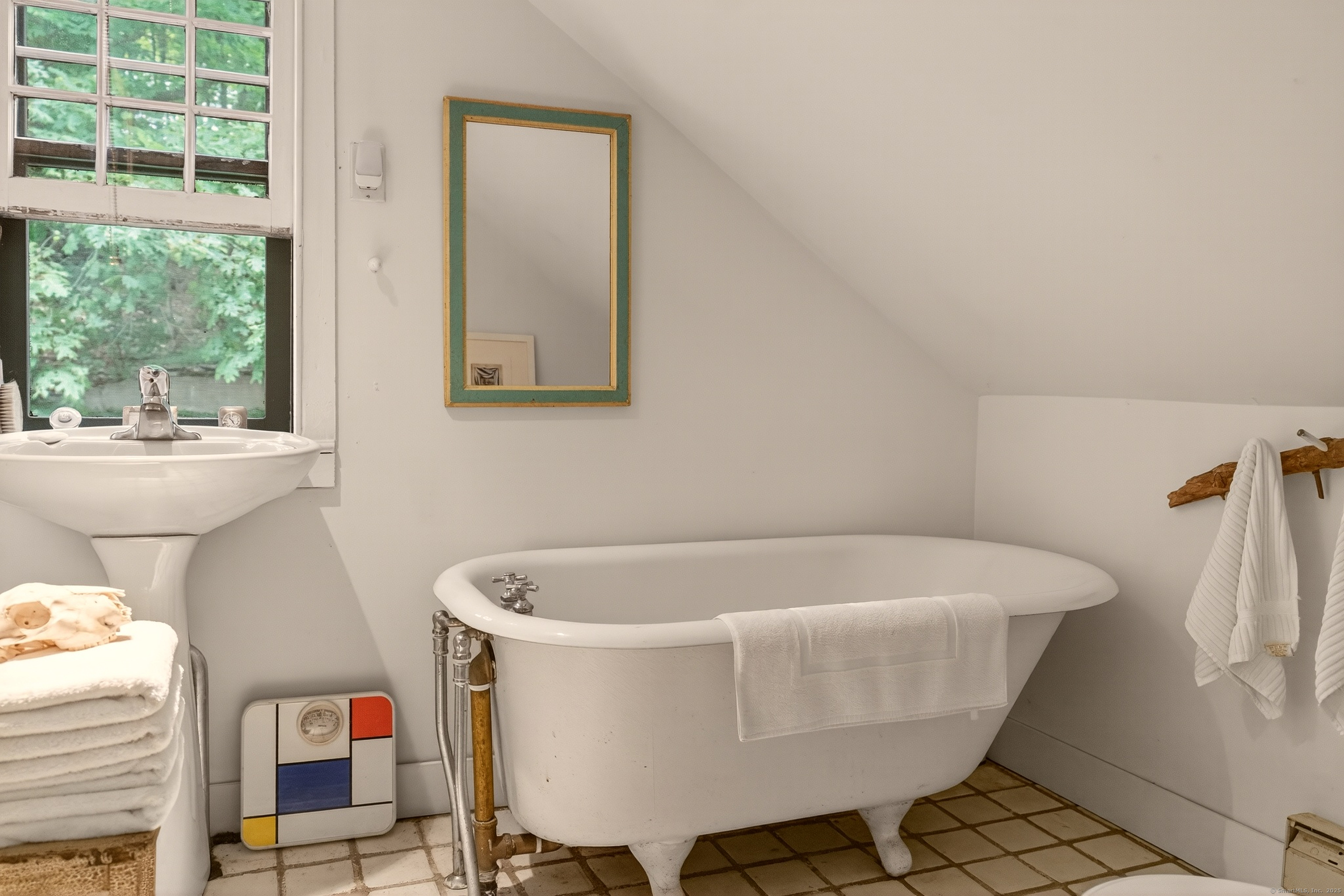 50 Southbury Road Roxbury, CT 06783 - Photo 21 of 31 a white bath tub sitting in a bathroom next to a window