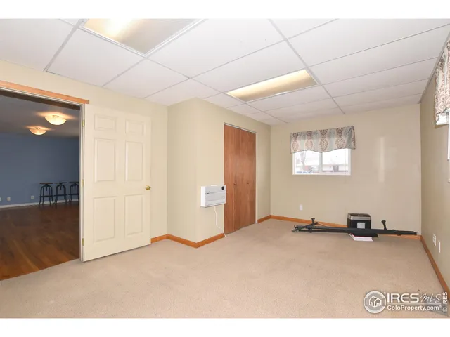 a bedroom with a bed and a cabinet