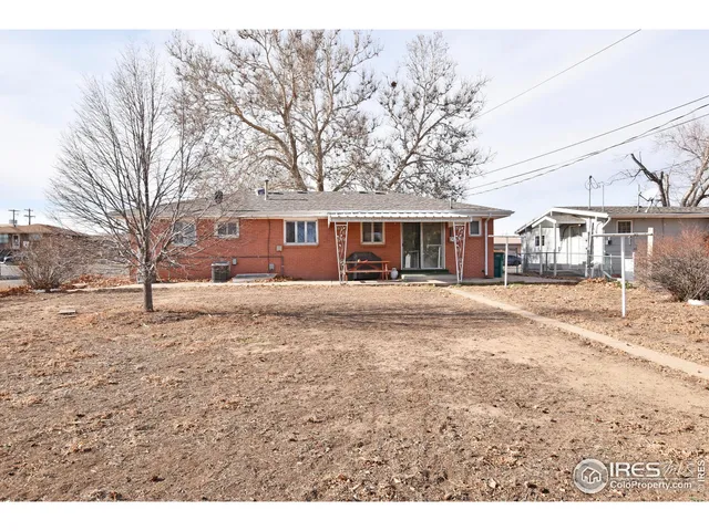 a view of large house with a yard