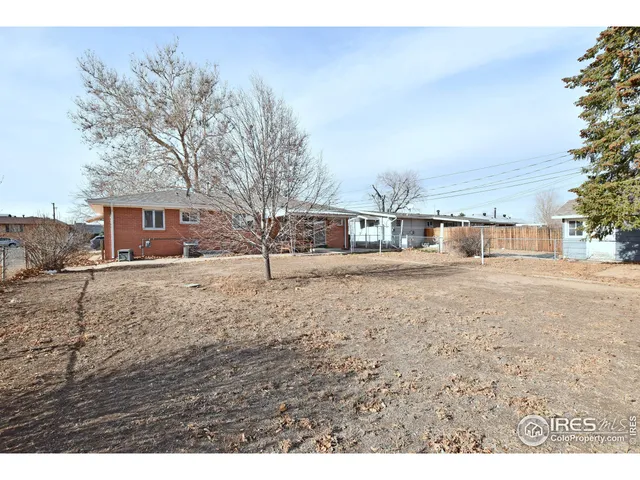 a view of road yard and trees