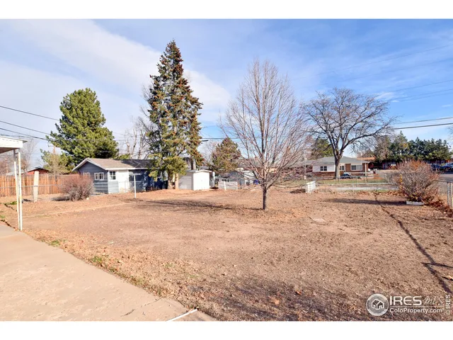 a view of a street with cars