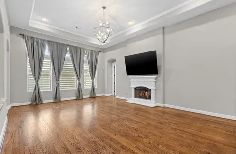 a view of a livingroom with an empty space and a fireplace