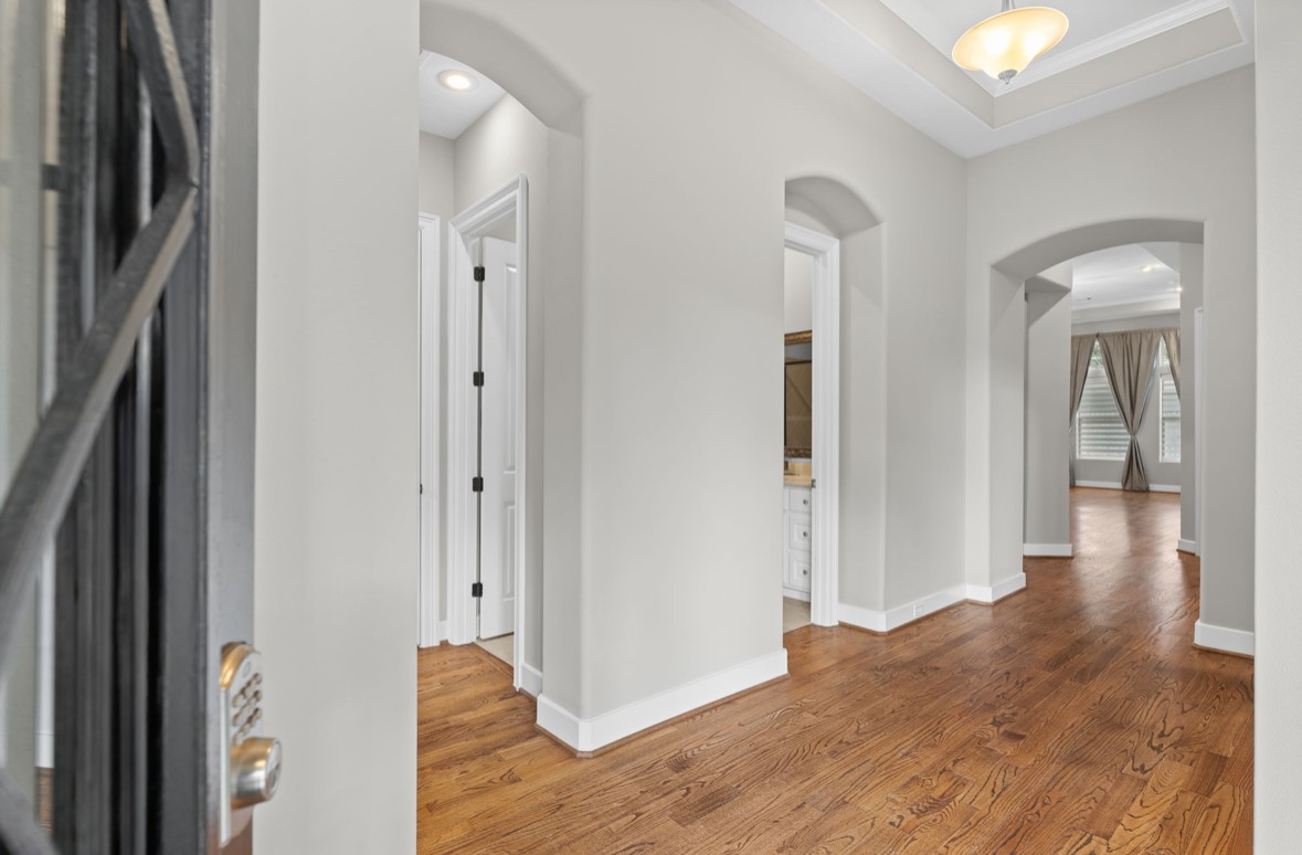 11206 Castille Lane Houston, TX 77082 - Photo 10 of 45 a view of a hallway with wooden floor