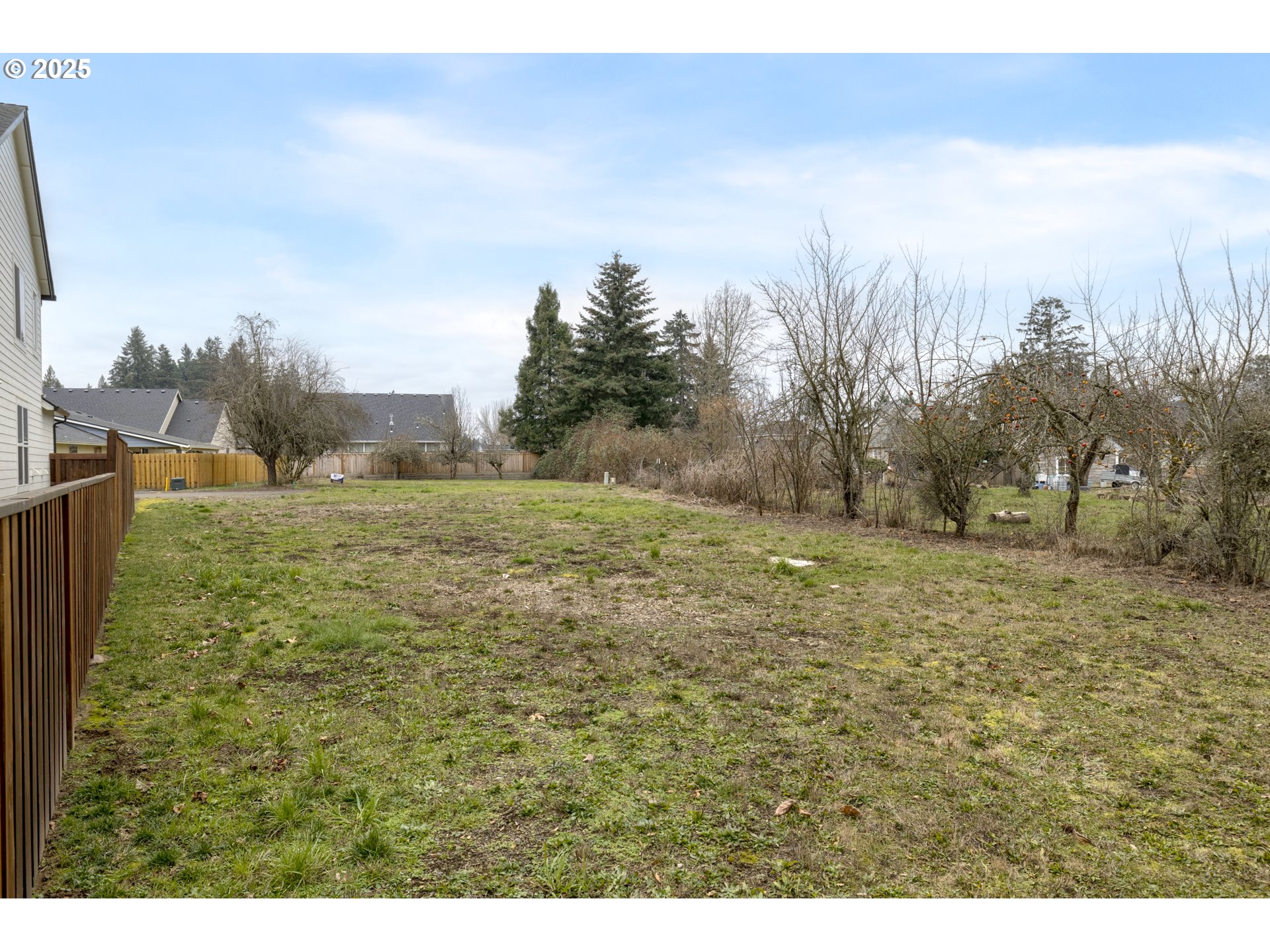2141 Northeast Spitz Road Canby, OR 97013 - Photo 8 of 15 a view of a field with trees in the background