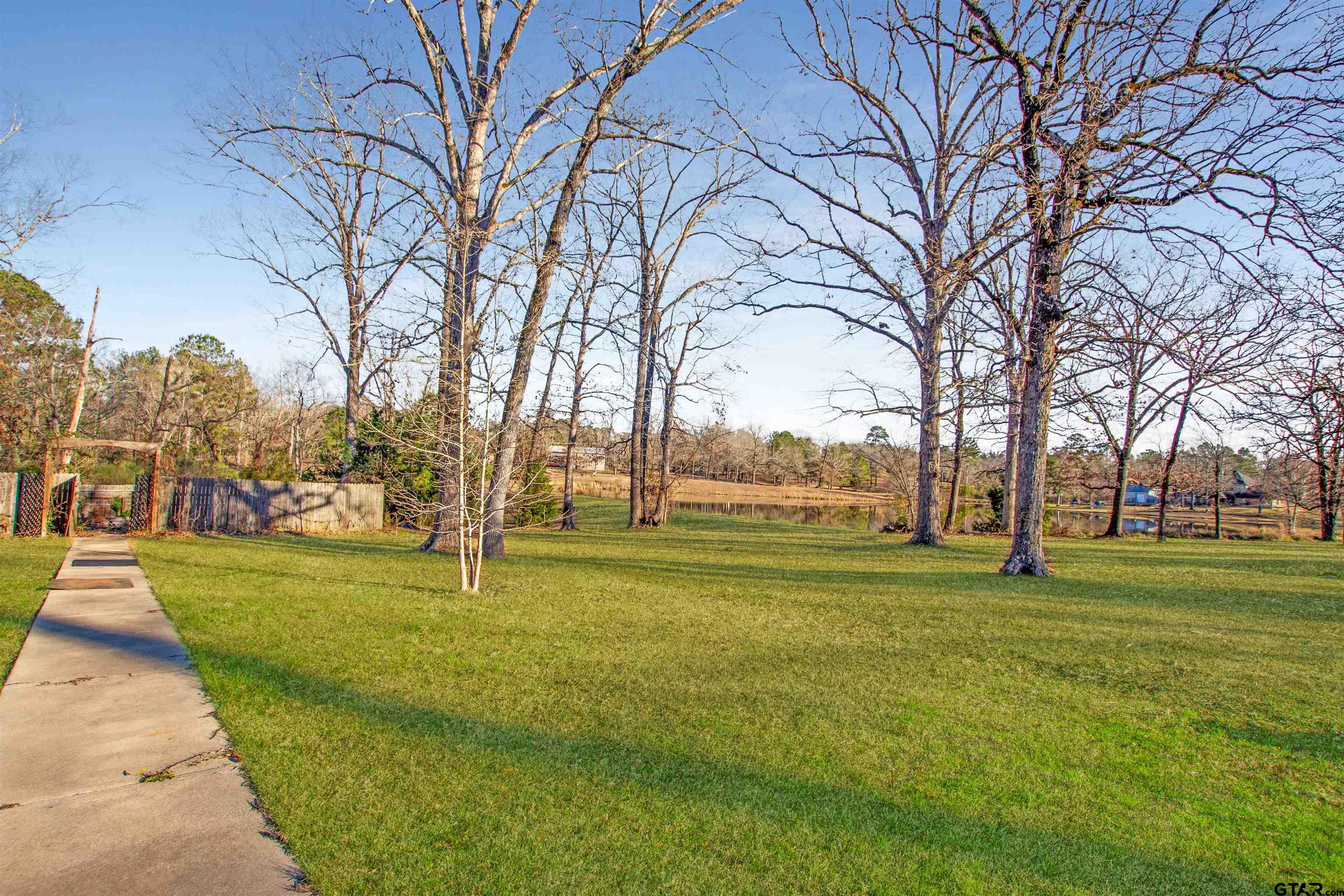 1687 West Point Road Kilgore, TX 75662 - Photo 39 of 41 a big yard with lots of trees and plants