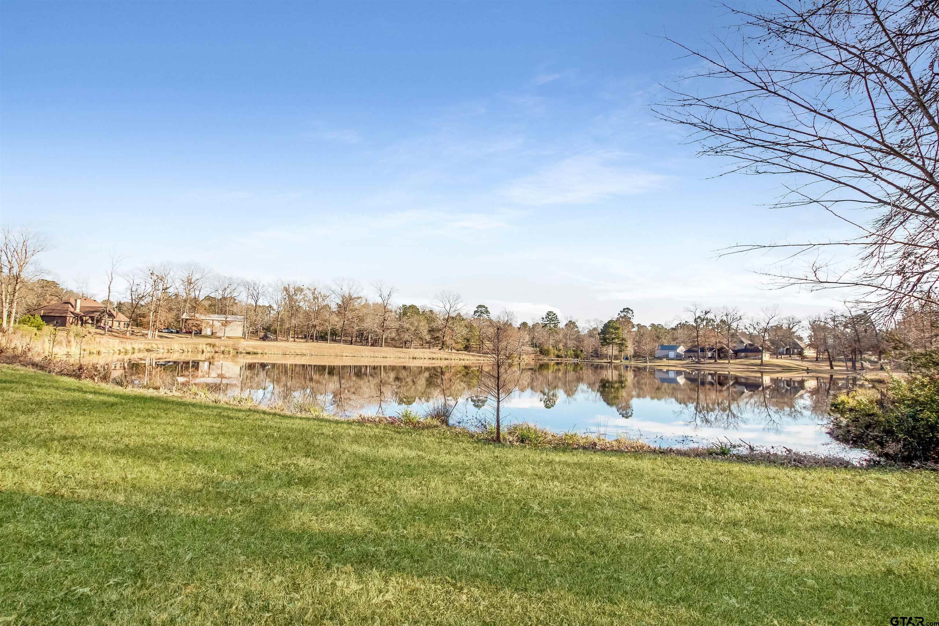 1687 West Point Road Kilgore, TX 75662 - Photo 41 of 41 a view of a lake with houses in the back