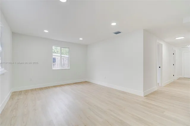 a kitchen with a sink a stove and cabinets