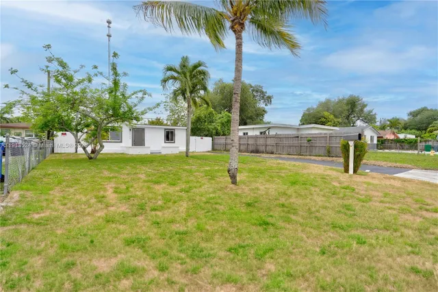 a view of a swimming pool with a garden
