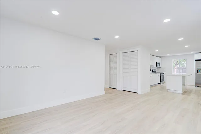 a view of kitchen with wooden floor