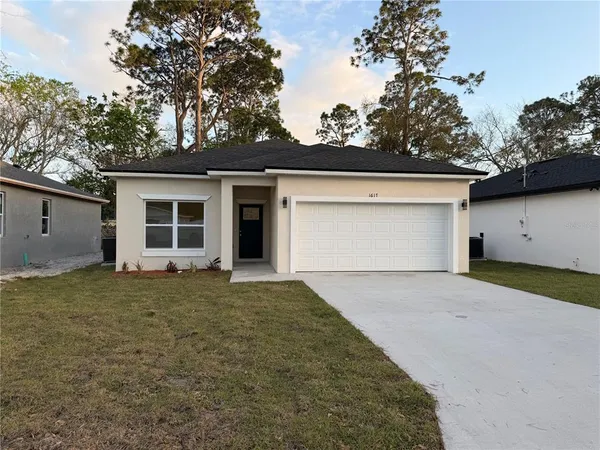a house with trees in the background
