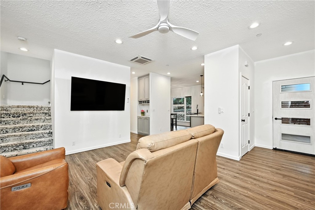 17234 Brookfield Road Hidden Valley Lake, CA 95467 - Photo 11 of 35 a living room with furniture and a flat screen tv