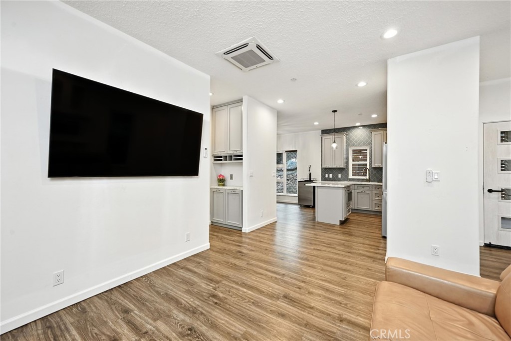 17234 Brookfield Road Hidden Valley Lake, CA 95467 - Photo 12 of 35 a view of a living room with flat screen tv and refrigerator