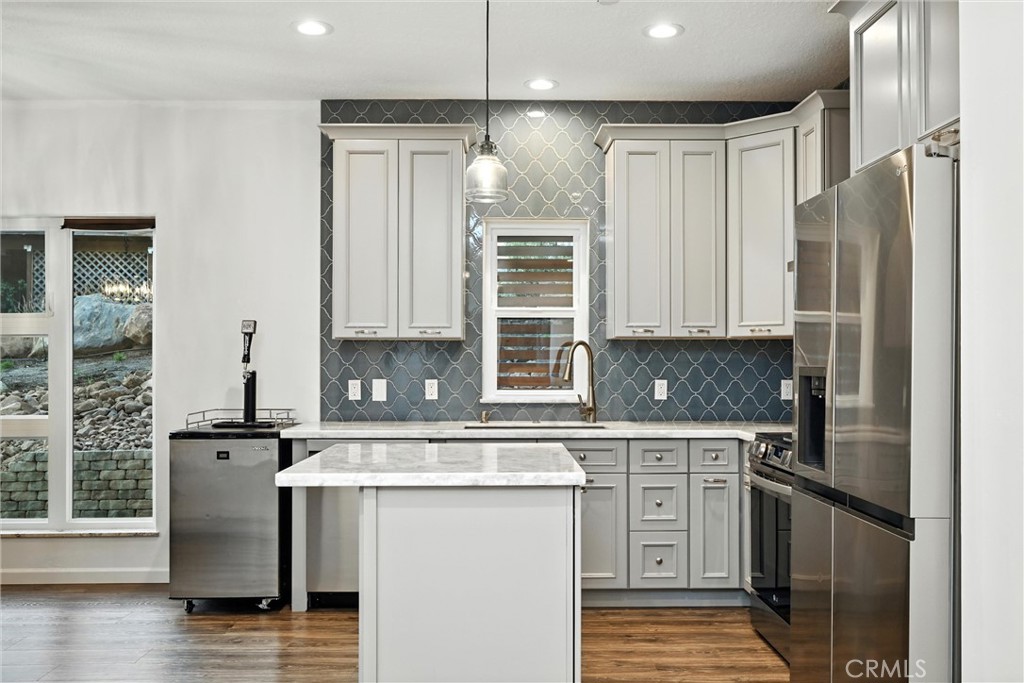 17234 Brookfield Road Hidden Valley Lake, CA 95467 - Photo 14 of 35 a kitchen with stainless steel appliances a refrigerator sink and cabinets