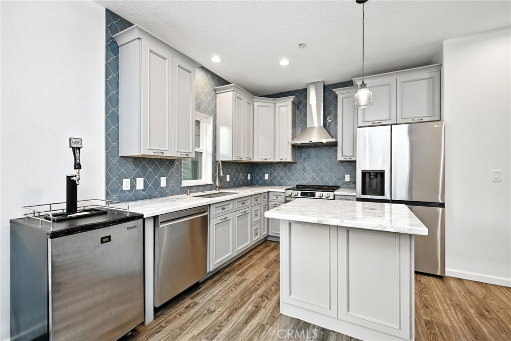 17234 Brookfield Road Hidden Valley Lake, CA 95467 - Photo 16 of 35 a kitchen with kitchen island granite countertop a sink appliances cabinets and furniture