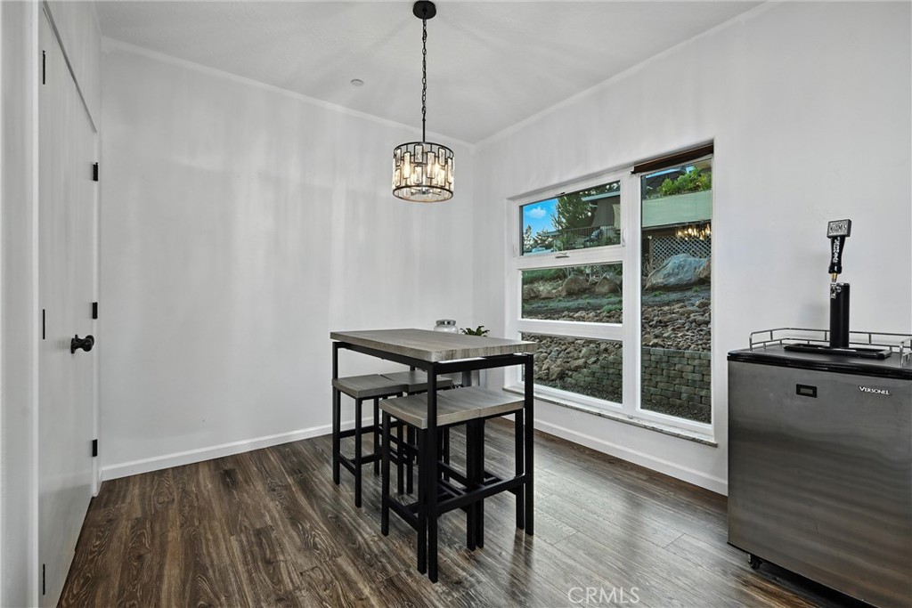 17234 Brookfield Road Hidden Valley Lake, CA 95467 - Photo 17 of 35 a view of a dining room with furniture window and wooden floor