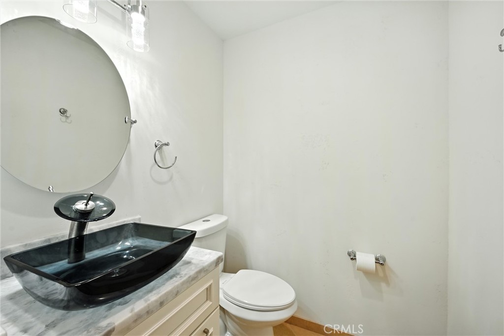 17234 Brookfield Road Hidden Valley Lake, CA 95467 - Photo 18 of 35 a bathroom with a toilet and a mirror