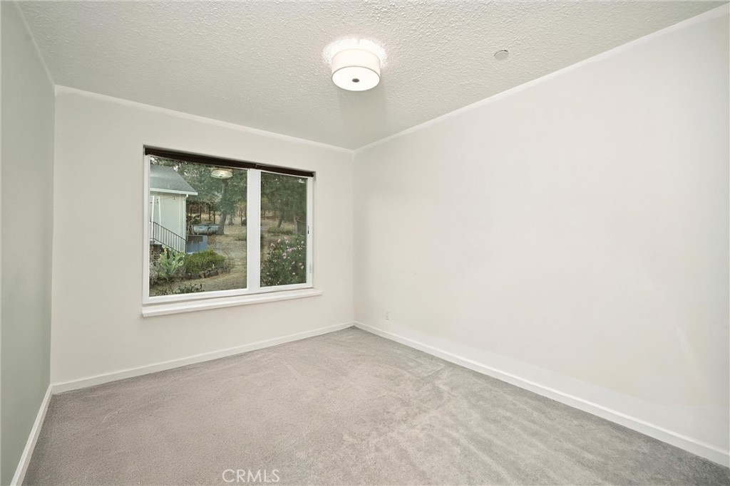 17234 Brookfield Road Hidden Valley Lake, CA 95467 - Photo 23 of 35 an empty room with a window