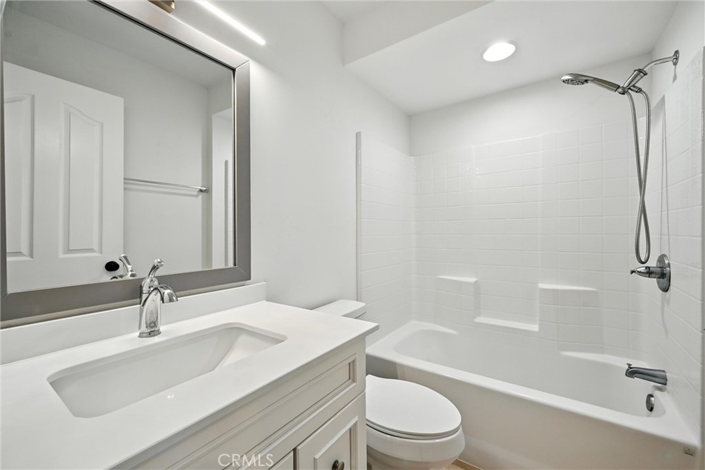 17234 Brookfield Road Hidden Valley Lake, CA 95467 - Photo 24 of 35 a bathroom with a granite countertop sink toilet and shower