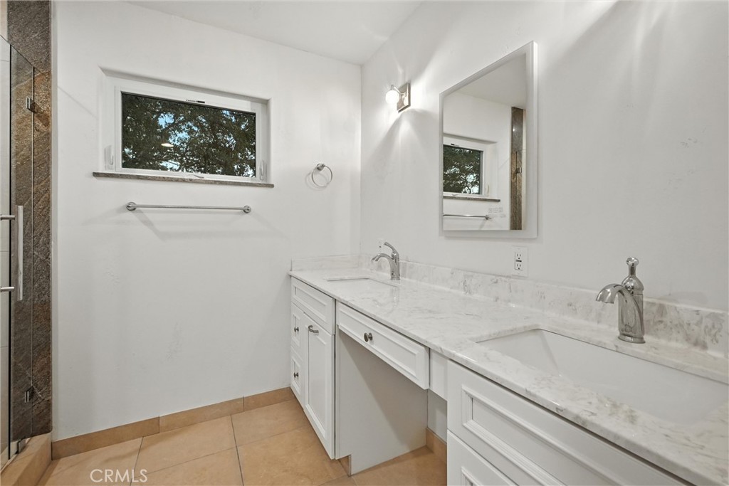 17234 Brookfield Road Hidden Valley Lake, CA 95467 - Photo 26 of 35 a bathroom with a sink and a mirror