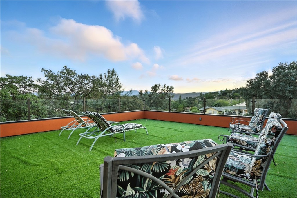 17234 Brookfield Road Hidden Valley Lake, CA 95467 - Photo 29 of 35 a view of an chairs and table in patio