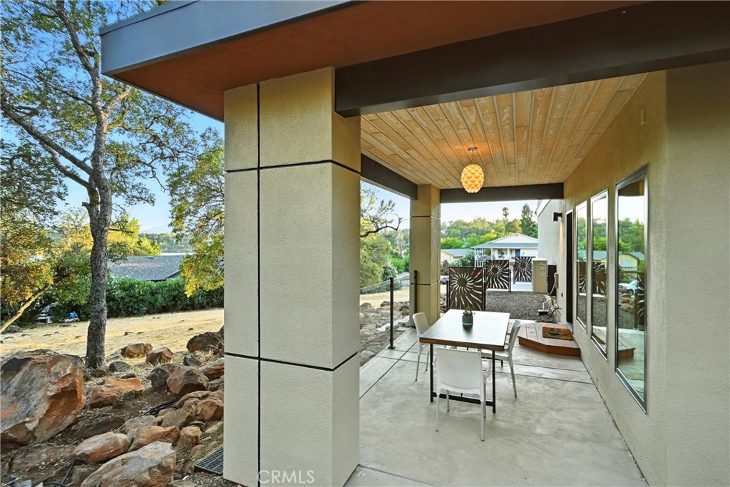 17234 Brookfield Road Hidden Valley Lake, CA 95467 - Photo 34 of 35 a living room with a floor to ceiling window and a table