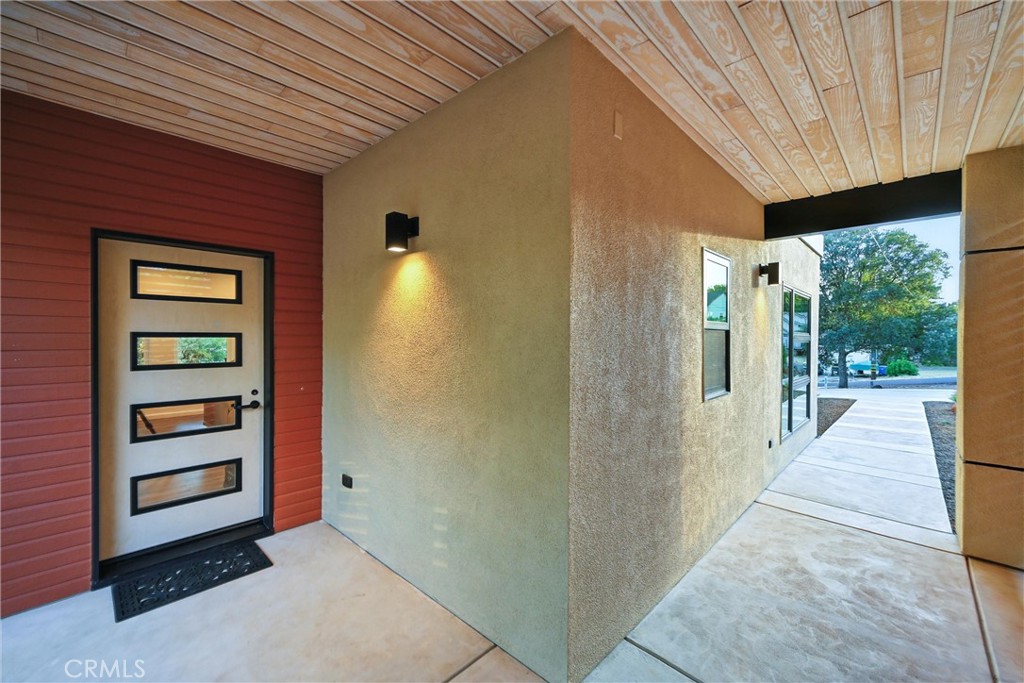 17234 Brookfield Road Hidden Valley Lake, CA 95467 - Photo 9 of 35 a view of a hallway with wooden walls and windows