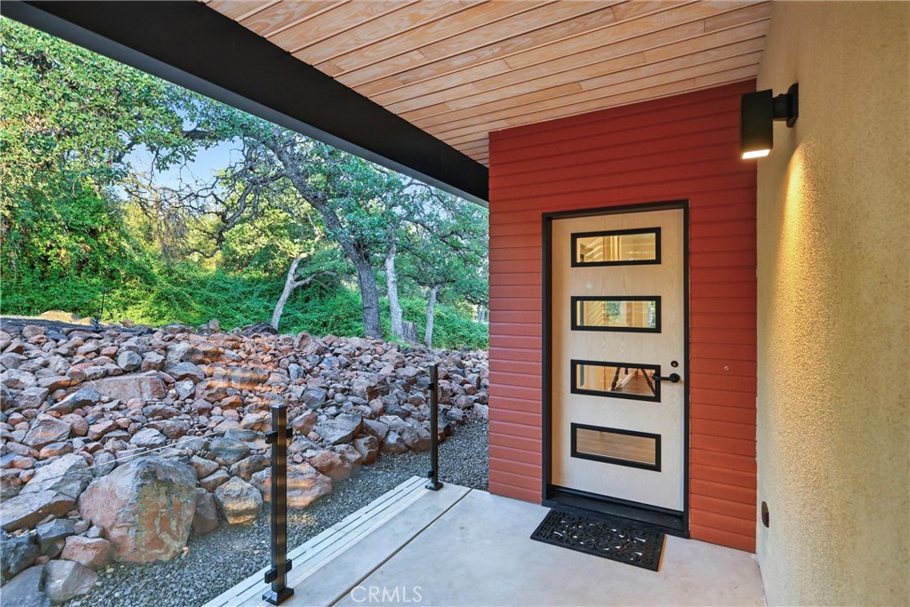 17234 Brookfield Road Hidden Valley Lake, CA 95467 - Photo 10 of 35 a front view of a house with a yard