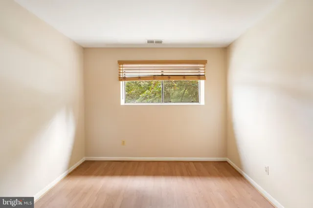 a kitchen with granite countertop a stove a sink and a microwave