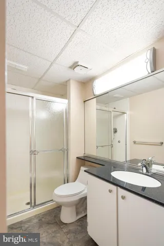 a view of a room with wooden floor and white walls