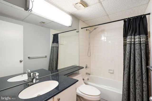 a view of an empty room and wooden floor