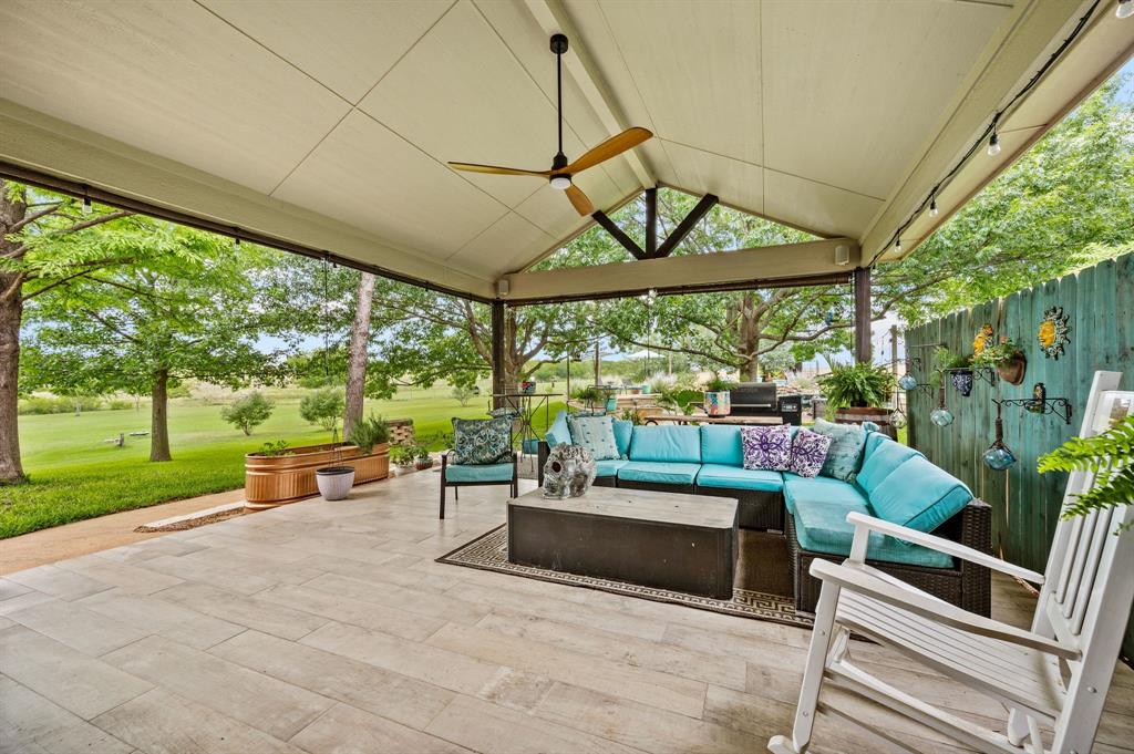 2141 Old Denton Road Decatur, TX 76234 - Photo 29 of 40 Expansive covered patio featuring a vaulted ceiling and tile flooring