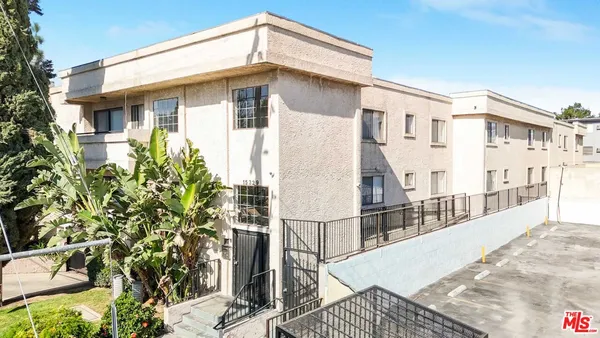 a view of buildings with yard