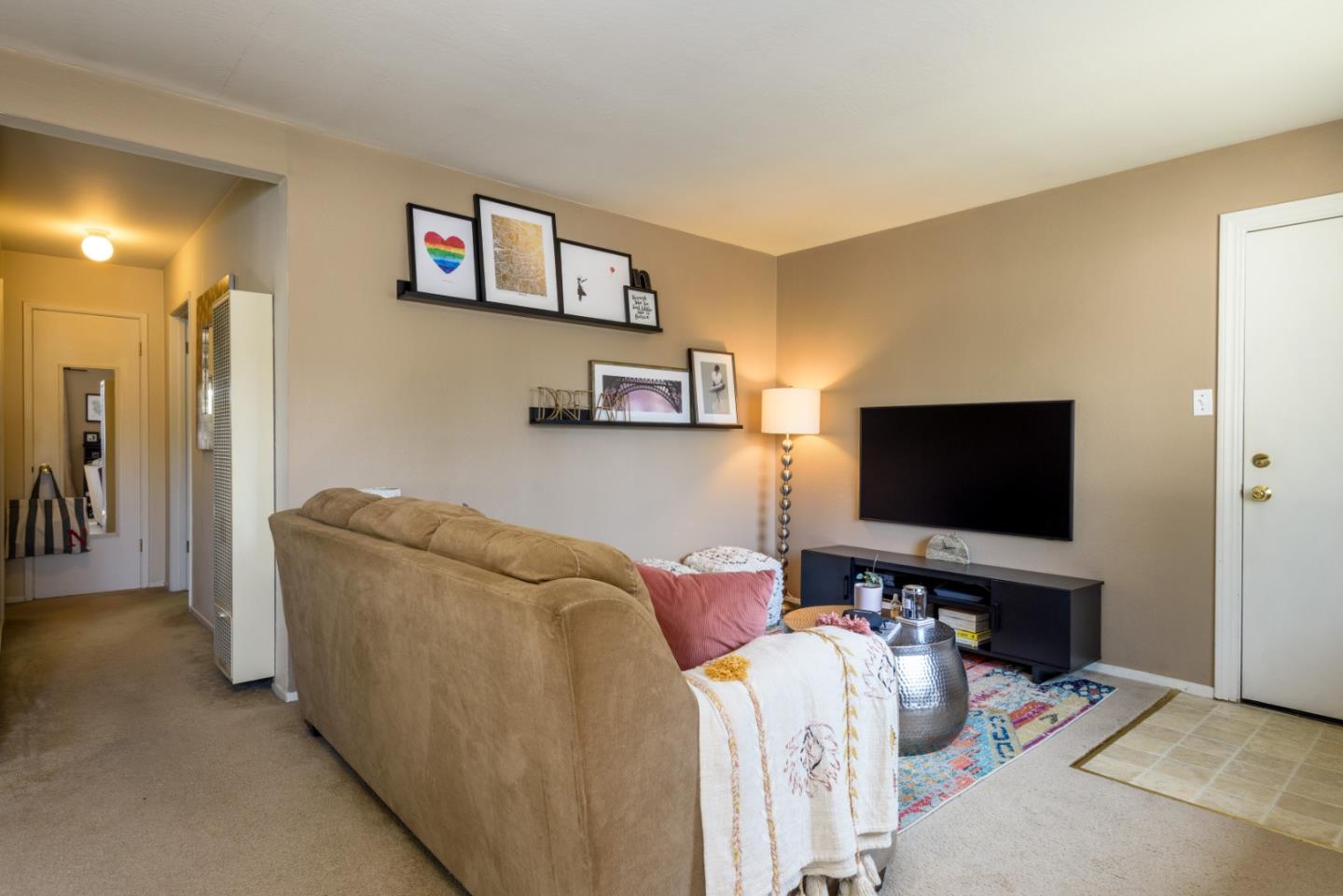 1437 Floribunda Avenue Burlingame, CA 94010 - Photo 16 of 35 a living room with furniture and a flat screen tv