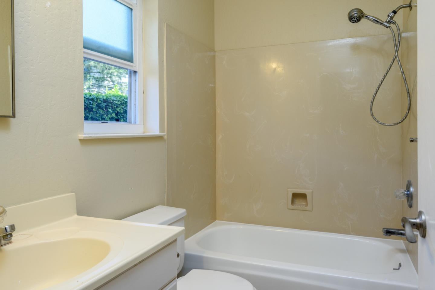 1437 Floribunda Avenue Burlingame, CA 94010 - Photo 19 of 35 a bathroom with a sink and a bathtub