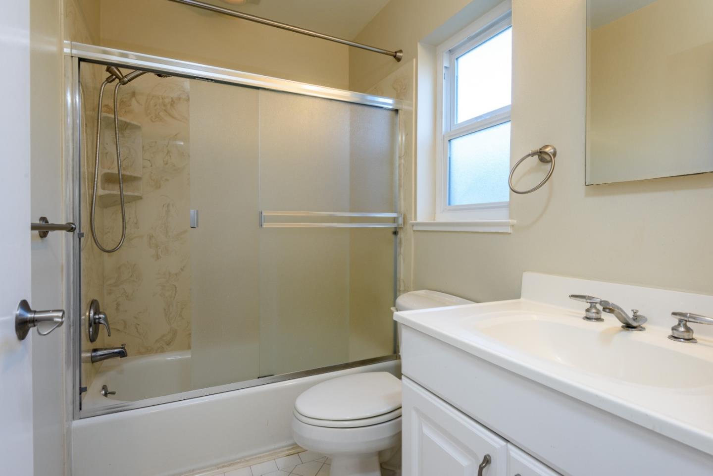 1437 Floribunda Avenue Burlingame, CA 94010 - Photo 24 of 35 a bathroom with a sink toilet and shower