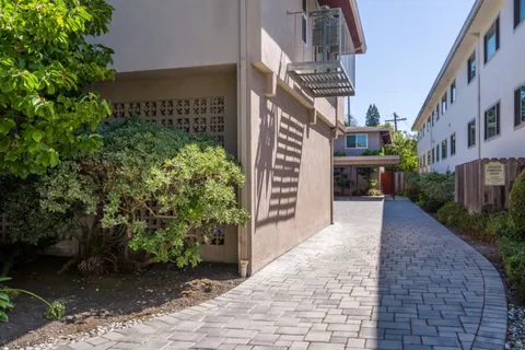 a view of a pathway along the path and trees