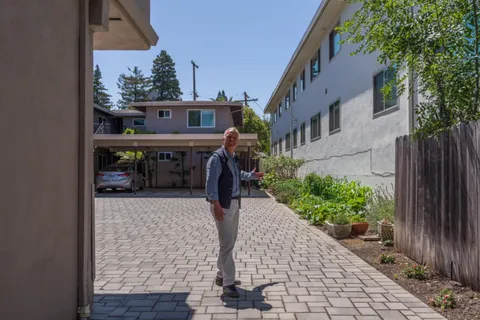 a view of a street with sitting area