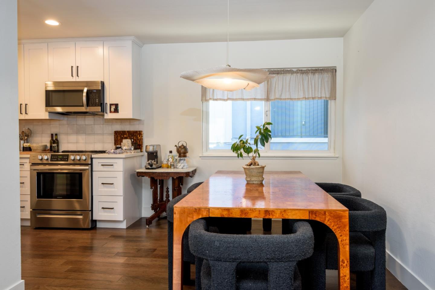 1437 Floribunda Avenue Burlingame, CA 94010 - Photo 9 of 35 a kitchen with stainless steel appliances a stove a sink and a microwave