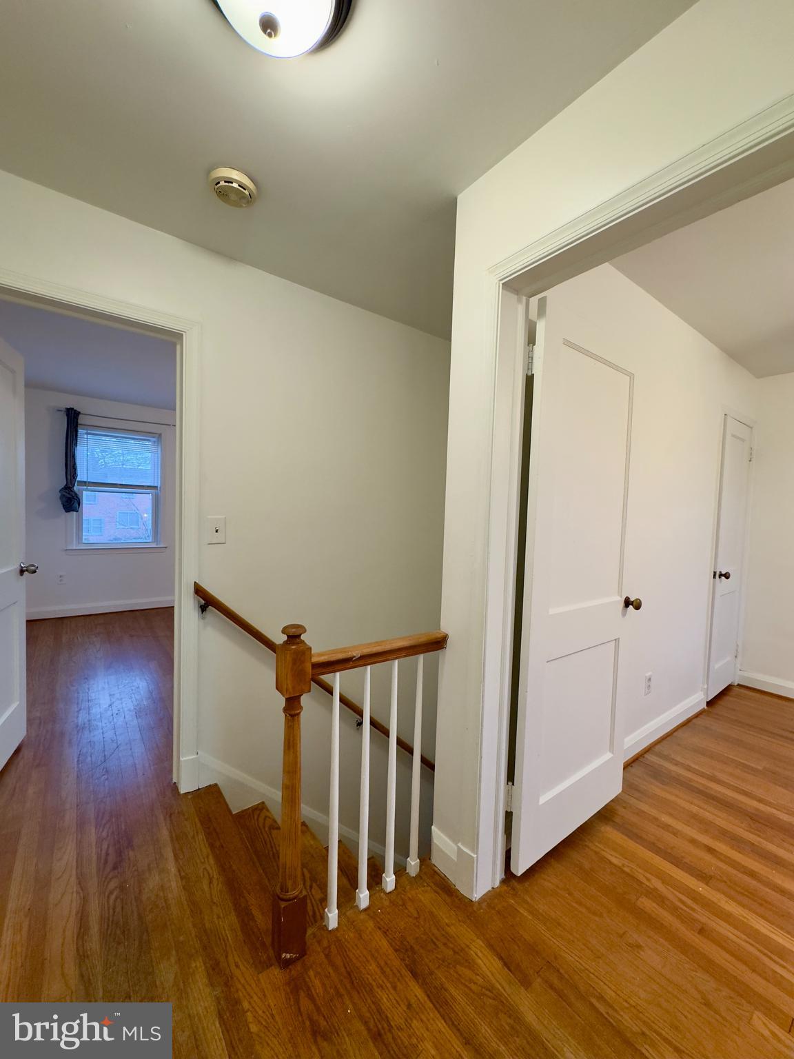 712 Bethnal Road Baltimore, MD 21229 - Photo 13 of 20 a view of a hallway with wooden floor