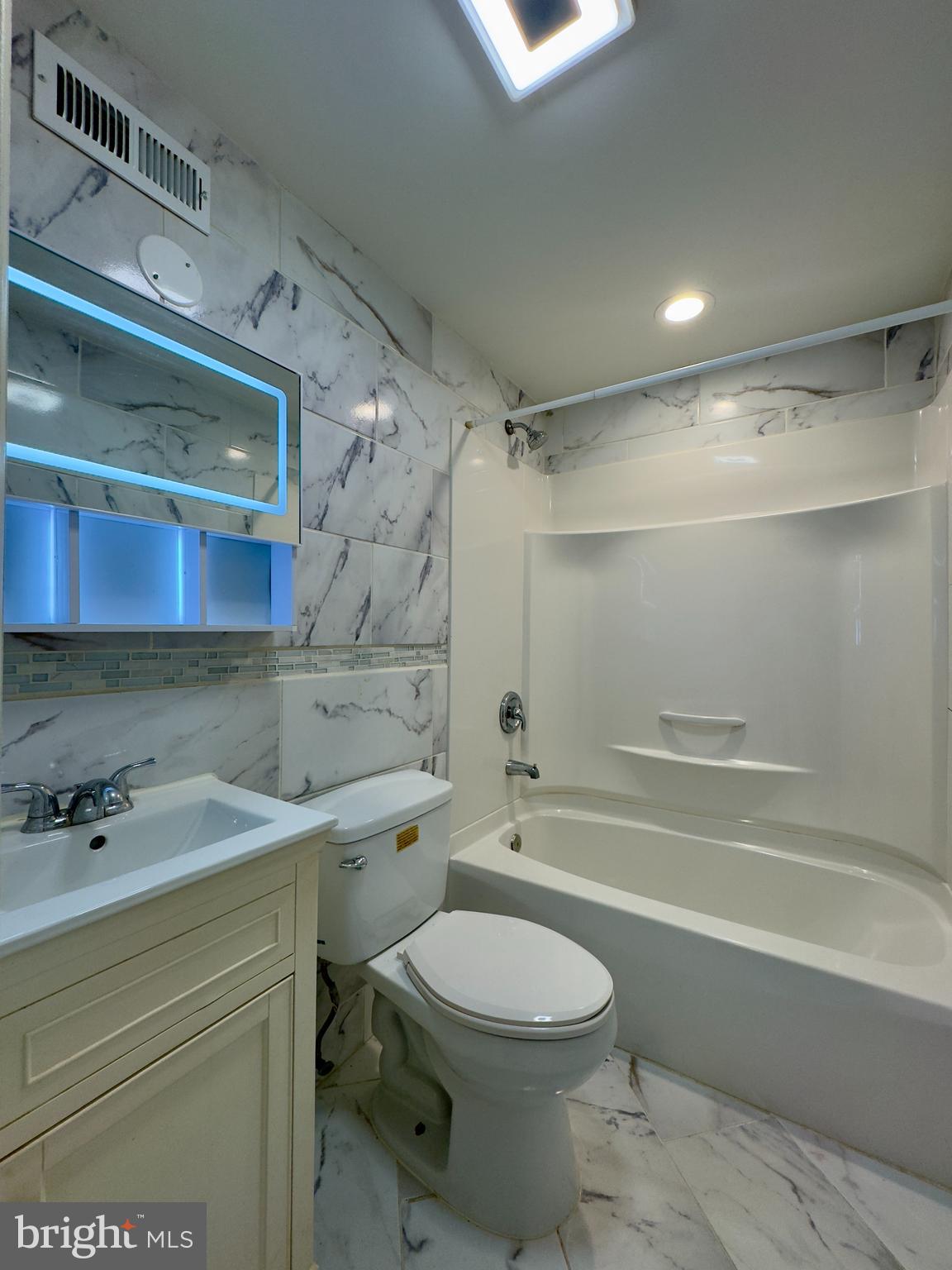 712 Bethnal Road Baltimore, MD 21229 - Photo 16 of 20 a bathroom with a sink a toilet and shower