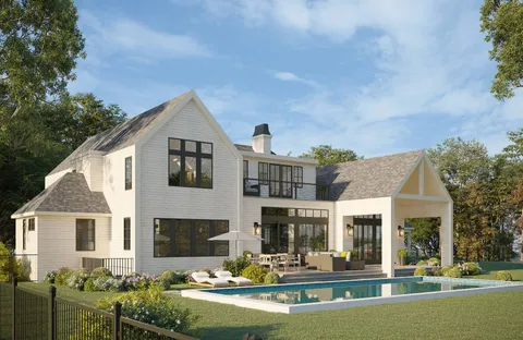 a front view of a house with swimming pool and chairs