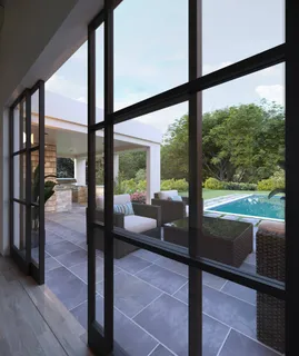 a living room with large windows