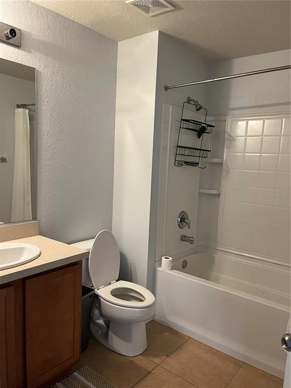 4971 Southwest 45th Street Ocala, FL 34474 - Photo 12 of 14 a white toilet sitting next to a bathtub