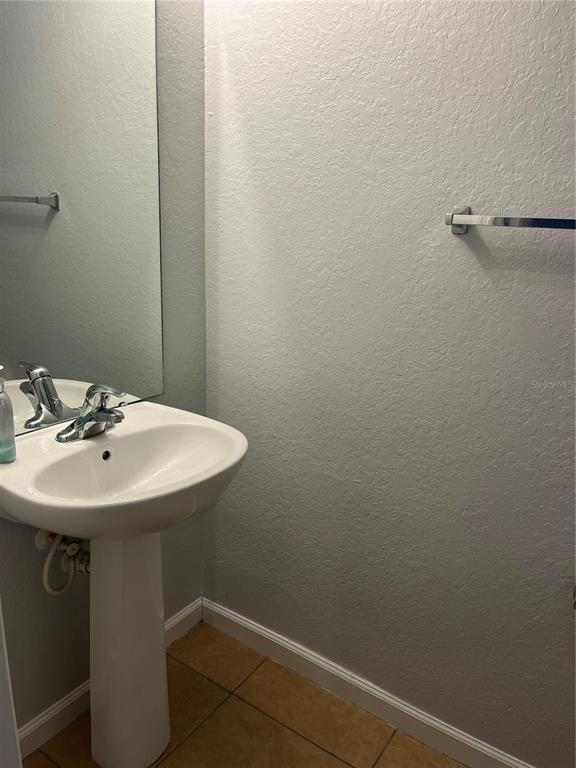4971 Southwest 45th Street Ocala, FL 34474 - Photo 6 of 14 a bathroom with a sink and mirror