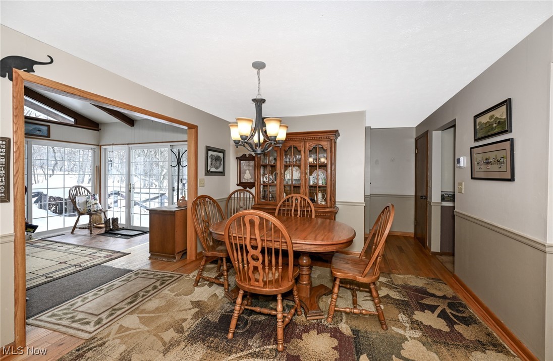 30875 Cannon Road Solon, OH 44139 - Photo 21 of 48 Dining room with a chandelier and wood floors