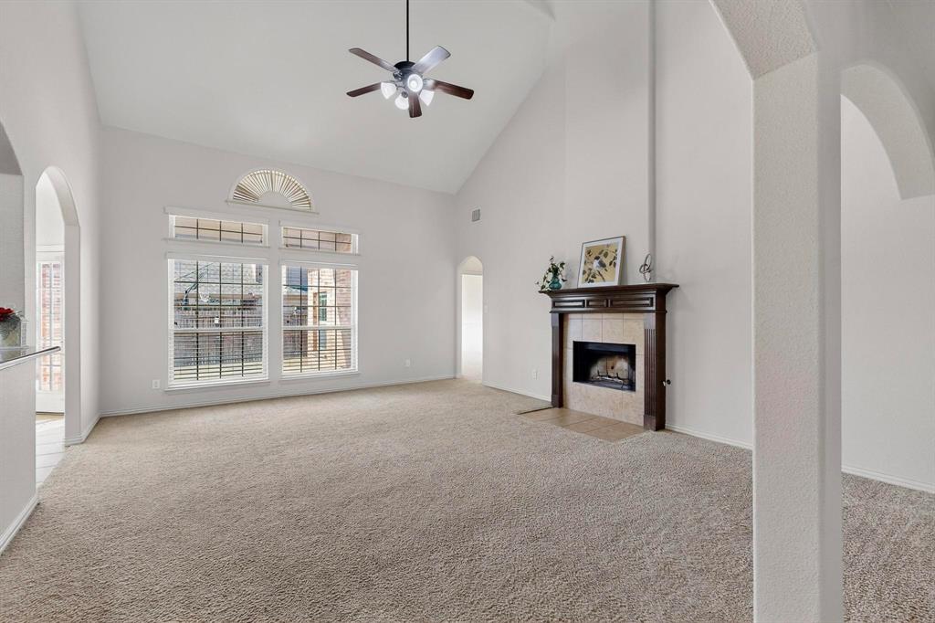 9329 Turtle Pass Fort Worth, TX 76177 - Photo 12 of 31 a view of an empty room with a fireplace and a window